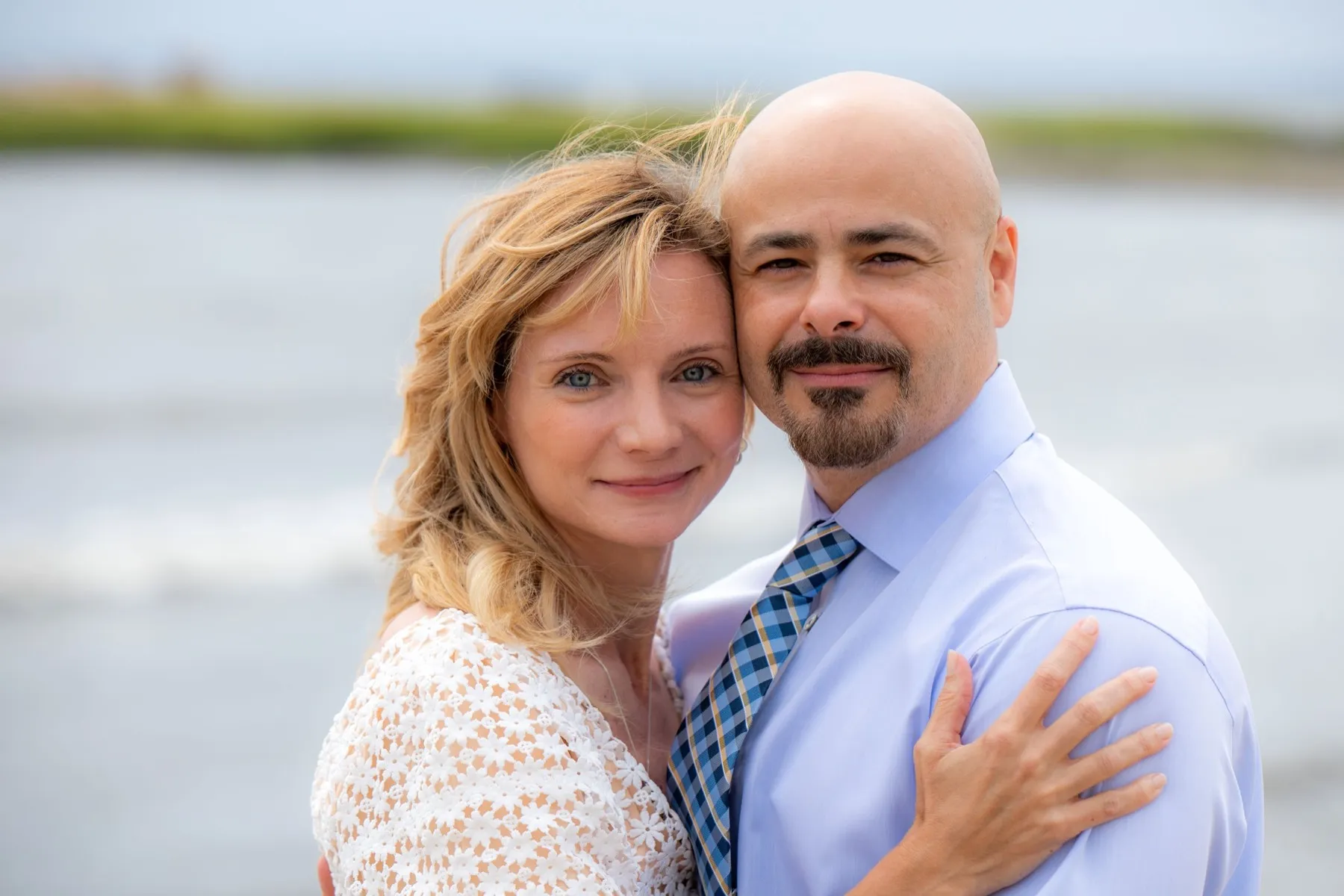 Jamie + Scott exchanging vows at Cove Island Beach, Stamford, CT