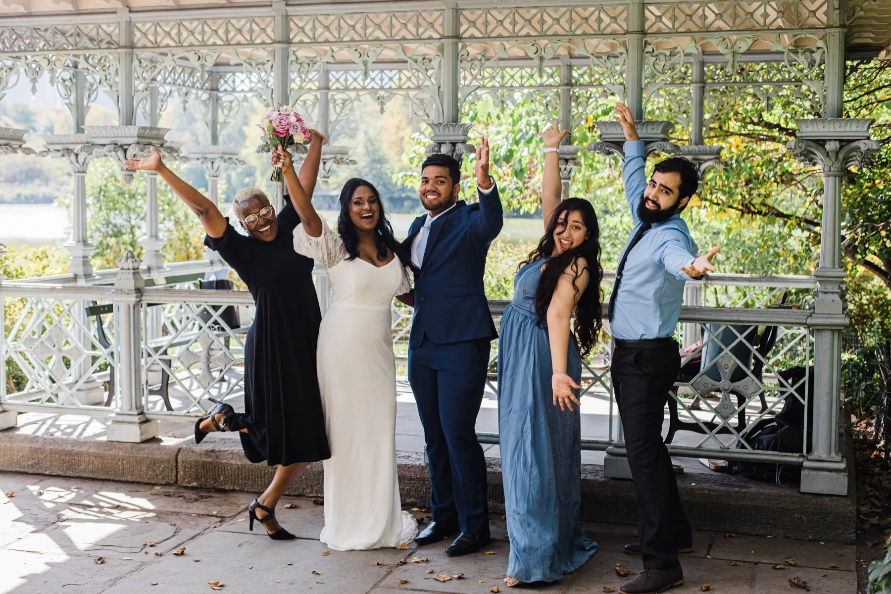 Clashani + Gihan celebrating after the ceremony at Ladies Pavilion, Central Park Wedding