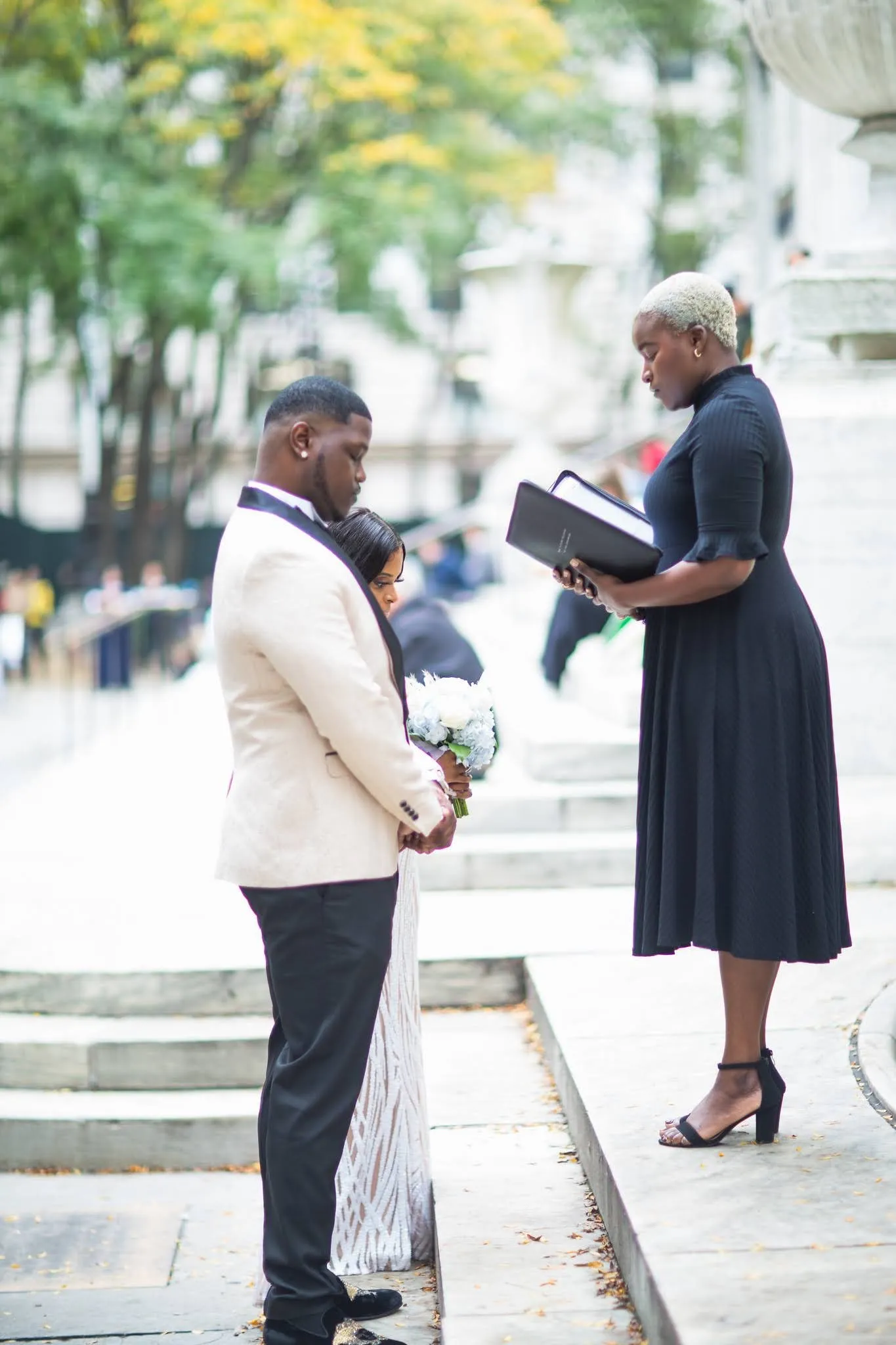 Patricia + Allen celebrating after the ceremony at New York Public Library, Stephen A Schwarzman Building