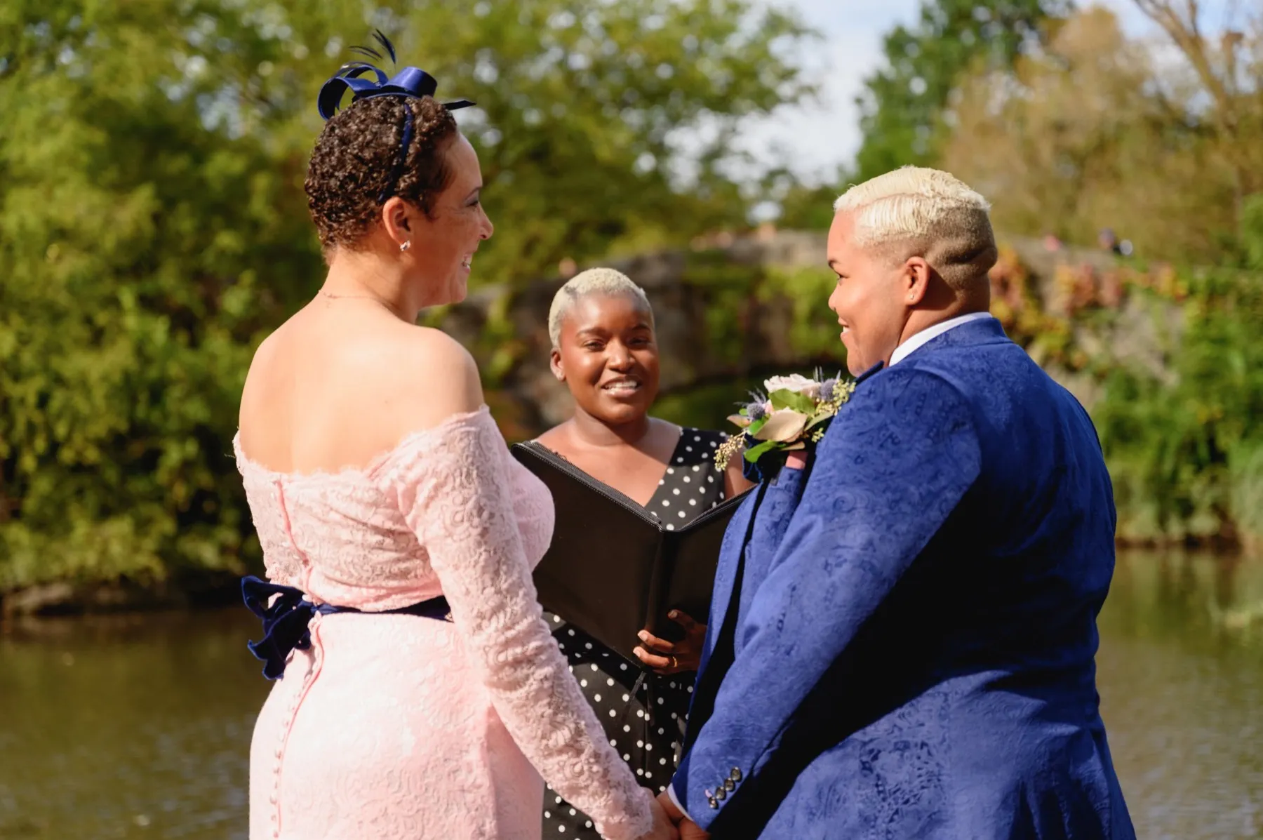 Veronica + Julie celebrating after the ceremony at Gapstow Bridge, Central Park Wedding