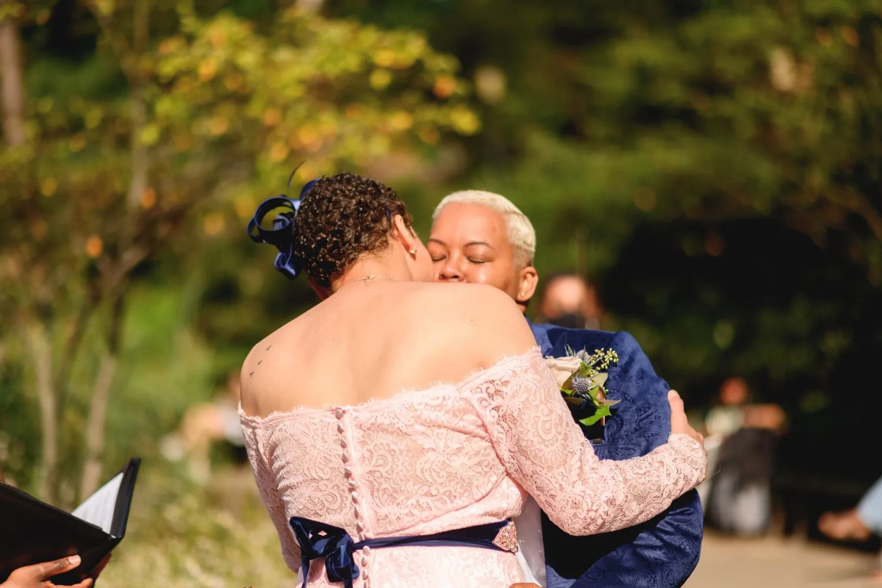 Veronica + Julie celebrating after the ceremony at Gapstow Bridge, Central Park Wedding