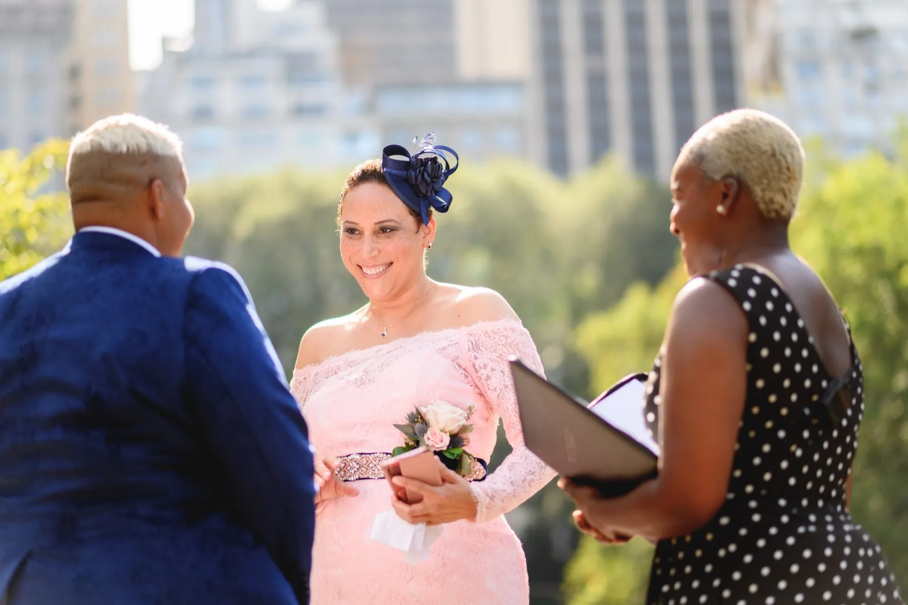Veronica + Julie exchanging vows at Gapstow Bridge, Central Park Wedding