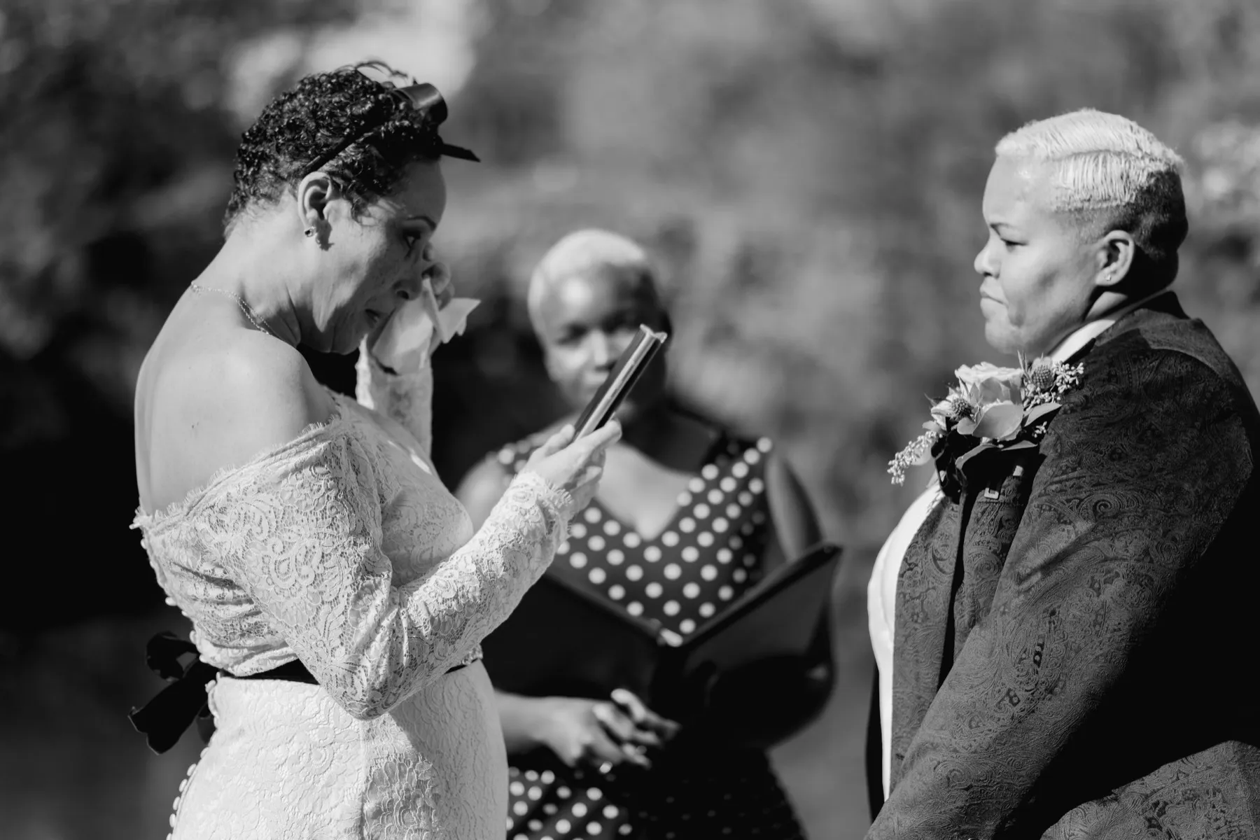 Veronica + Julie celebrating after the ceremony at Gapstow Bridge, Central Park Wedding