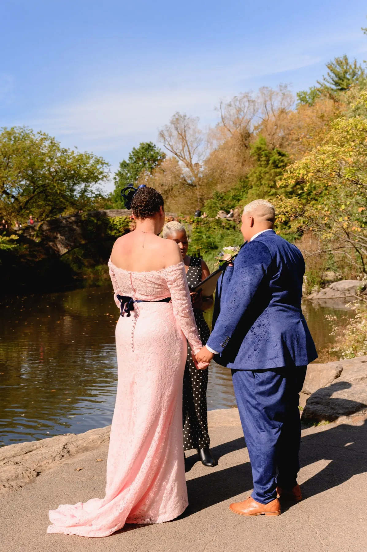 Veronica + Julie exchanging vows at Gapstow Bridge, Central Park Wedding