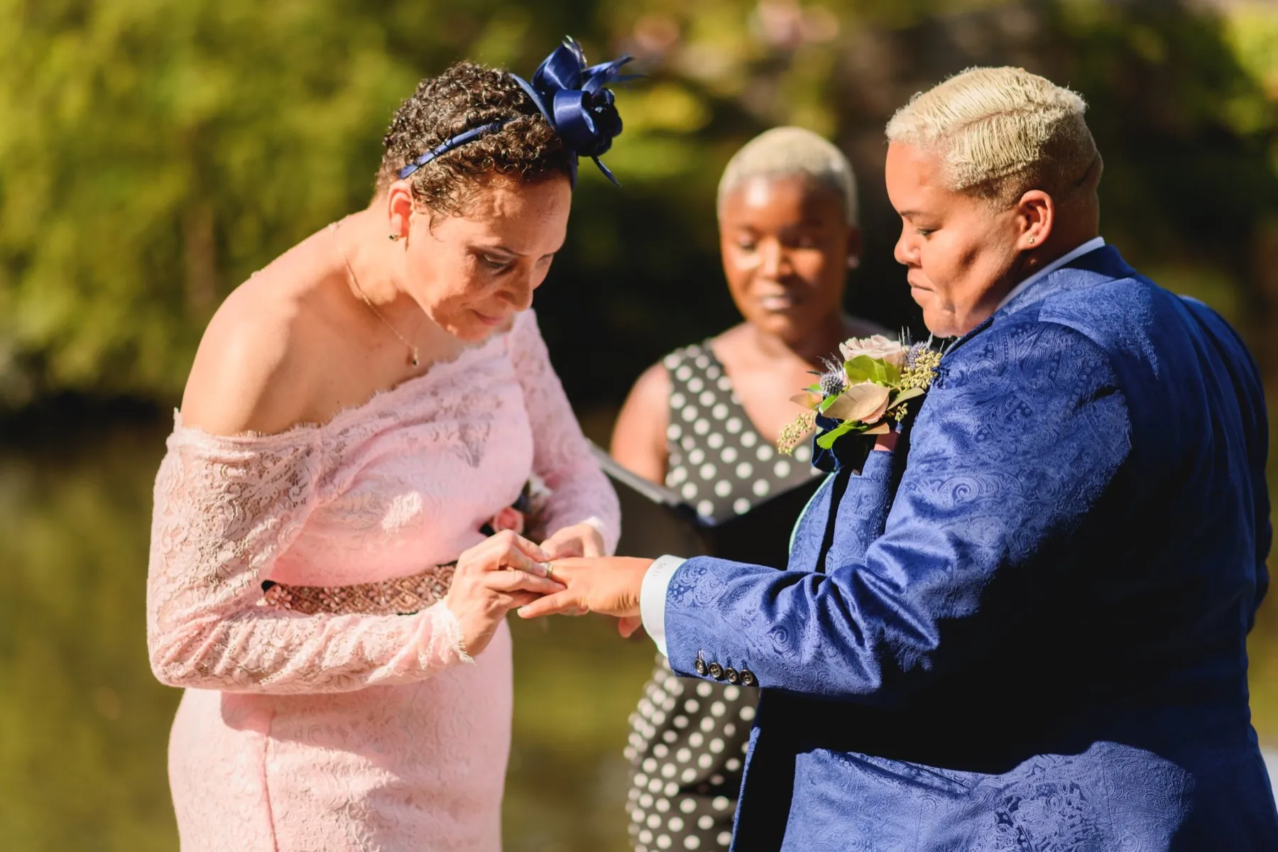 Veronica + Julie celebrating after the ceremony at Gapstow Bridge, Central Park Wedding