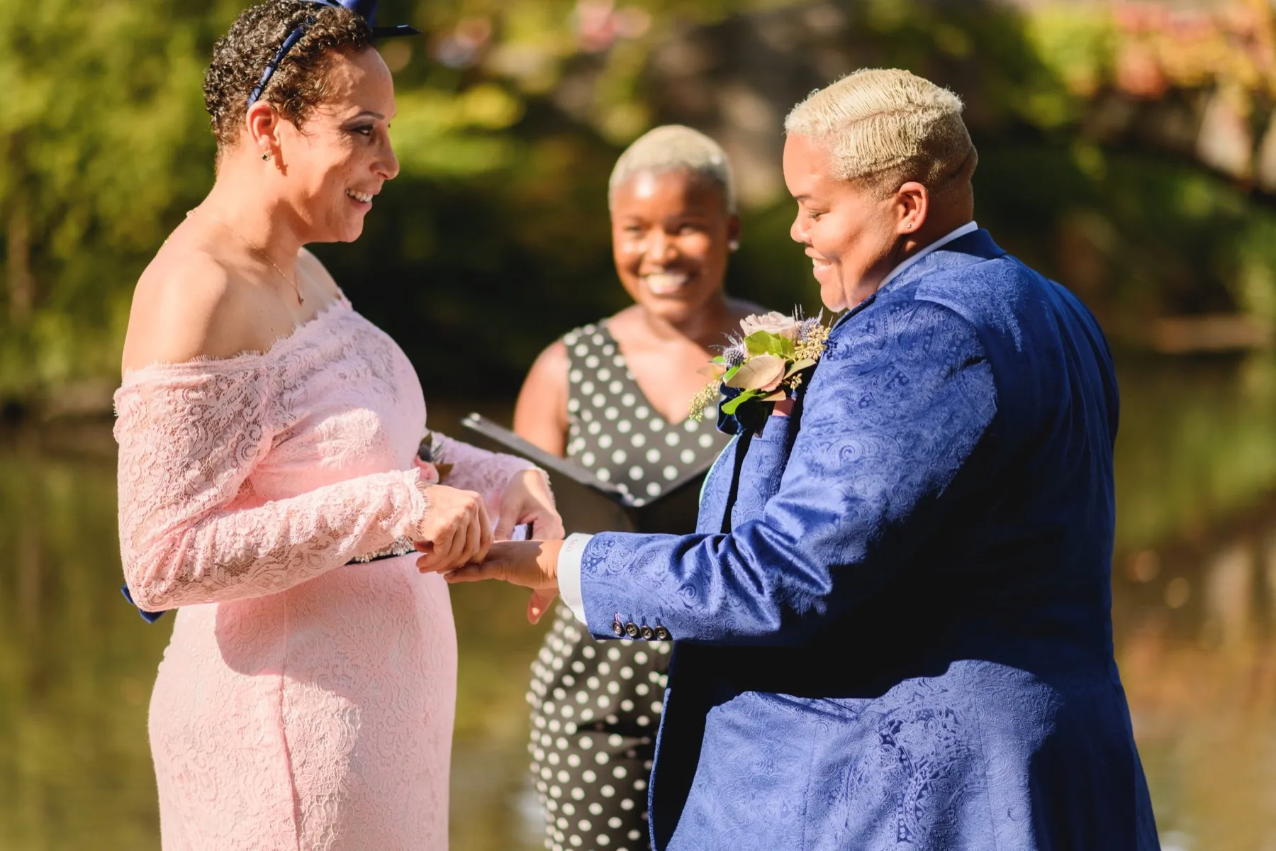 Wedding day moment for Veronica + Julie at Gapstow Bridge, Central Park Wedding