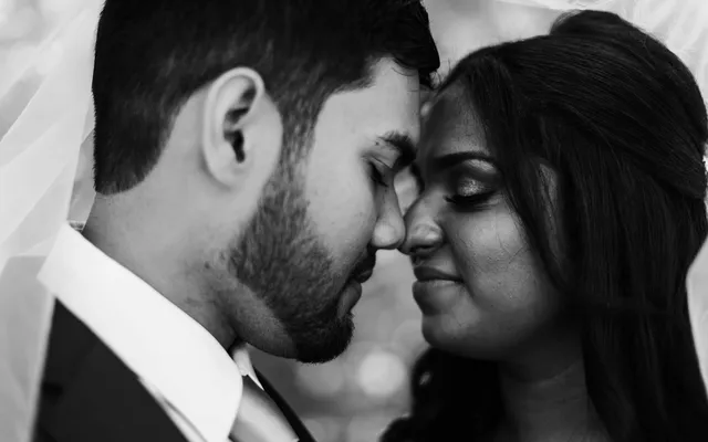 A couple reading hand-written wedding vows