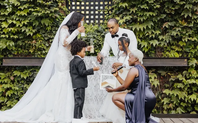 A couple performing a unity ceremony during their wedding