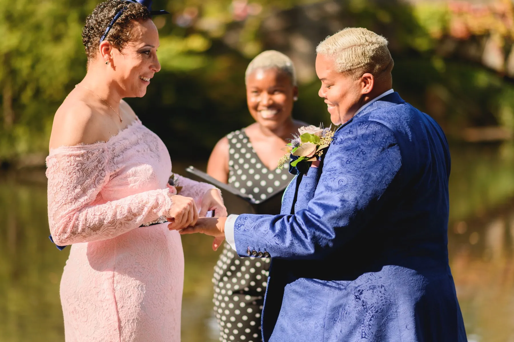 An LGBTQIA couple embracing after their wedding ceremony