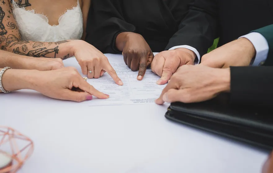 A marriage license document on a desk, ready to be signed