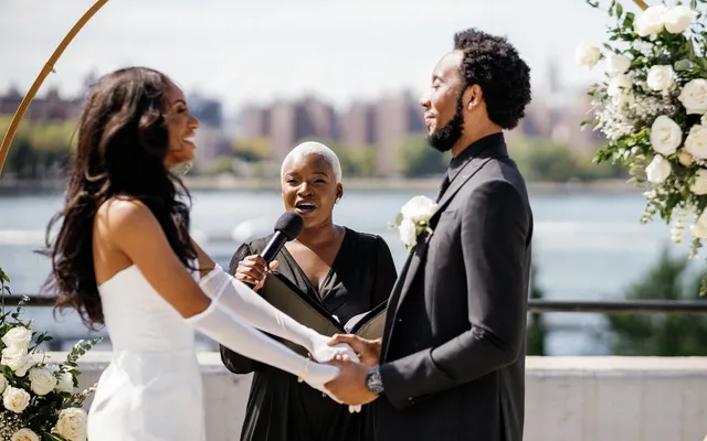 A wedding ceremony in progress as the couple stands together