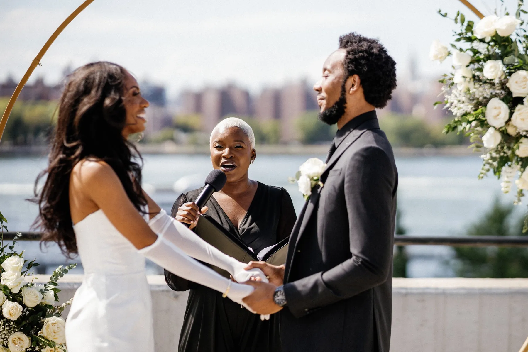 Robyn Walker officiating a couple reading their vows in NYC
