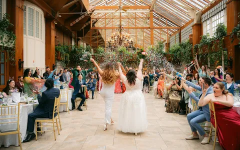 Robyn celebrating with a couple after their ceremony