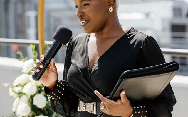 An officiant leading a wedding ceremony in front of guests