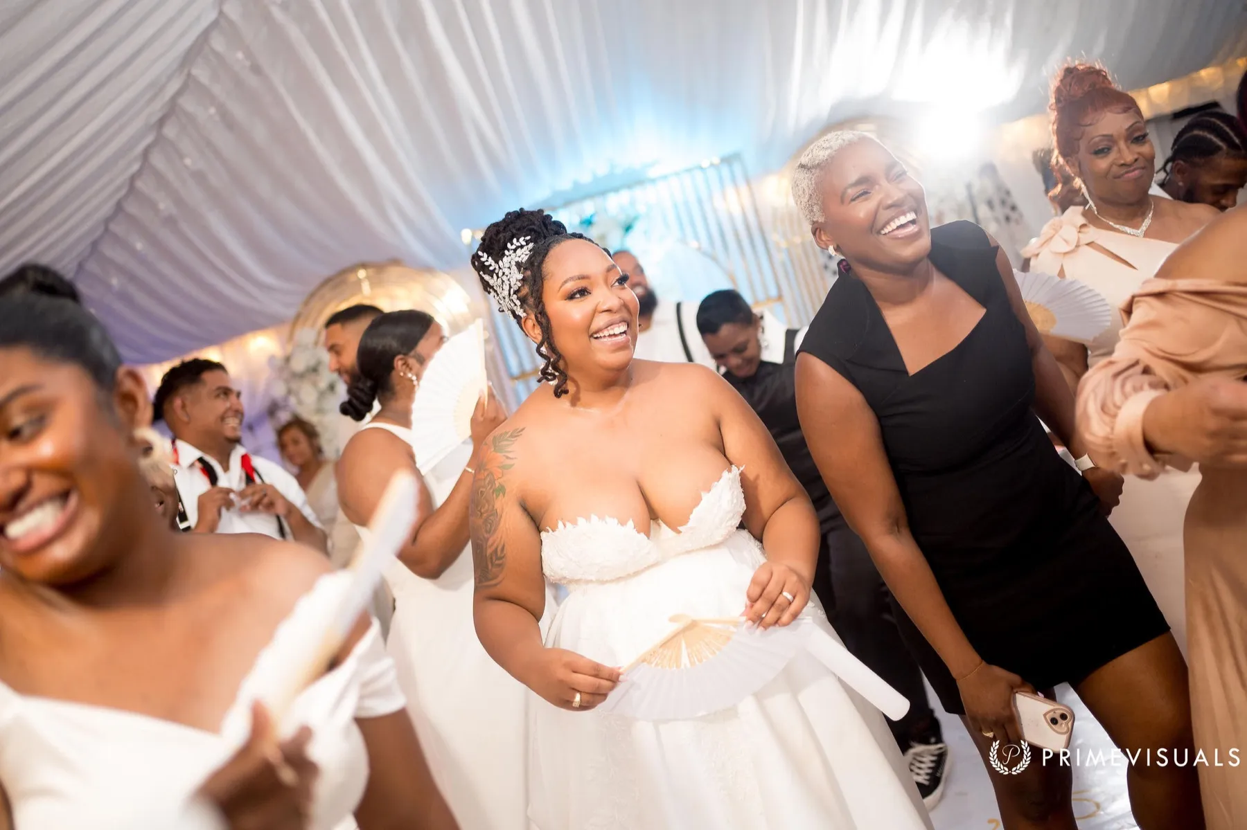 Robyn Walker dancing with wedding guests at a reception