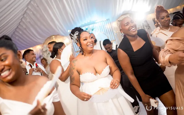 Robyn celebrating joyfully with wedding guests