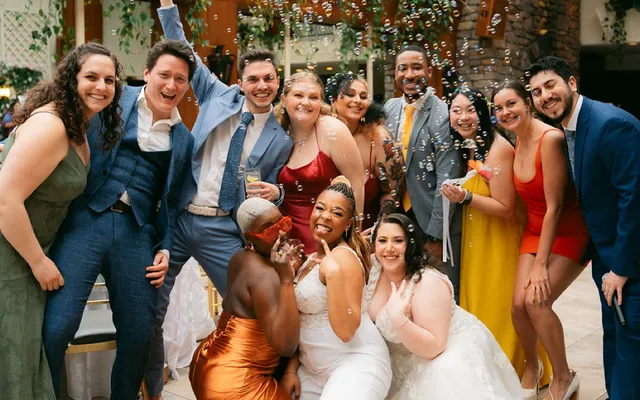 Robyn celebrating with a wedding party after the ceremony