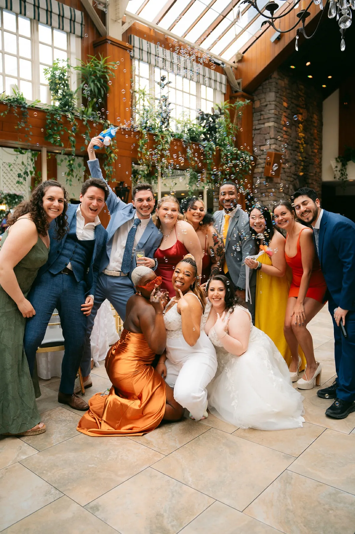 Robyn Walker laughing with the wedding party after the ceremony