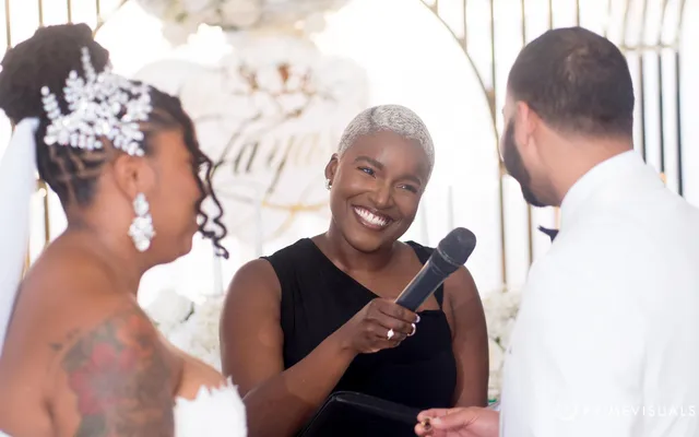 Robyn smiling during a wedding ceremony