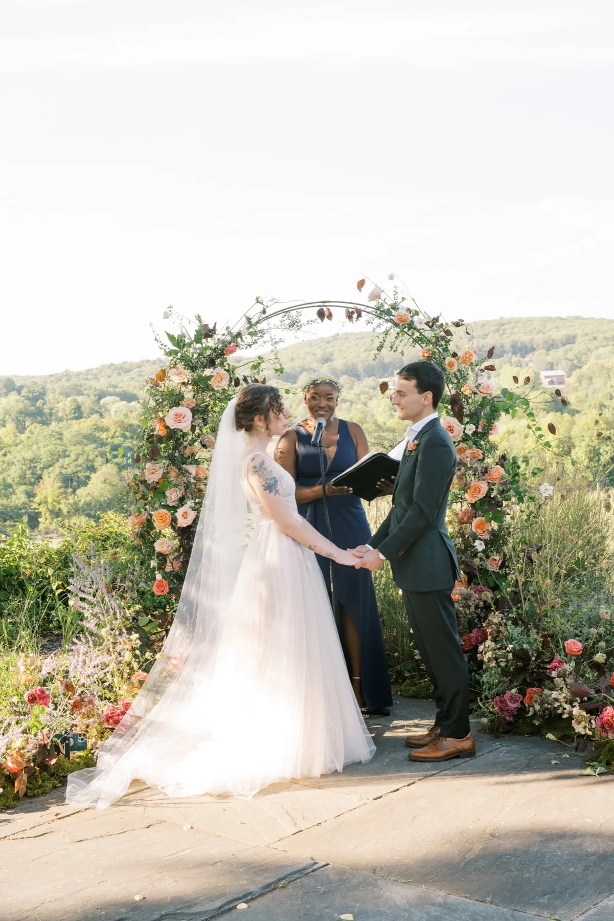 A couple sharing their first kiss as newlyweds