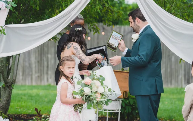A couple including a unity ritual in their wedding ceremony