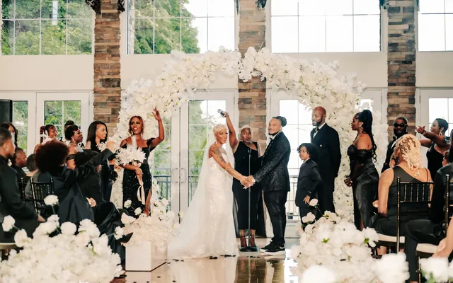 A joyful wedding party gathered after the ceremony